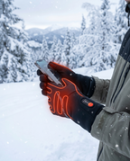 Battery-heated winter gloves worn in snow, lifestyle