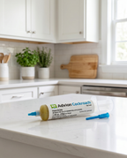 Indoor pest-control gel bait syringe on a kitchen counter, product photo